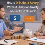 A clean and realistic scene of two people having an open financial discussion with coins, a piggy bank, and a budget notebook, representing how to Talk About Money Without Shame or Anxiety in a comfortable and practical way.